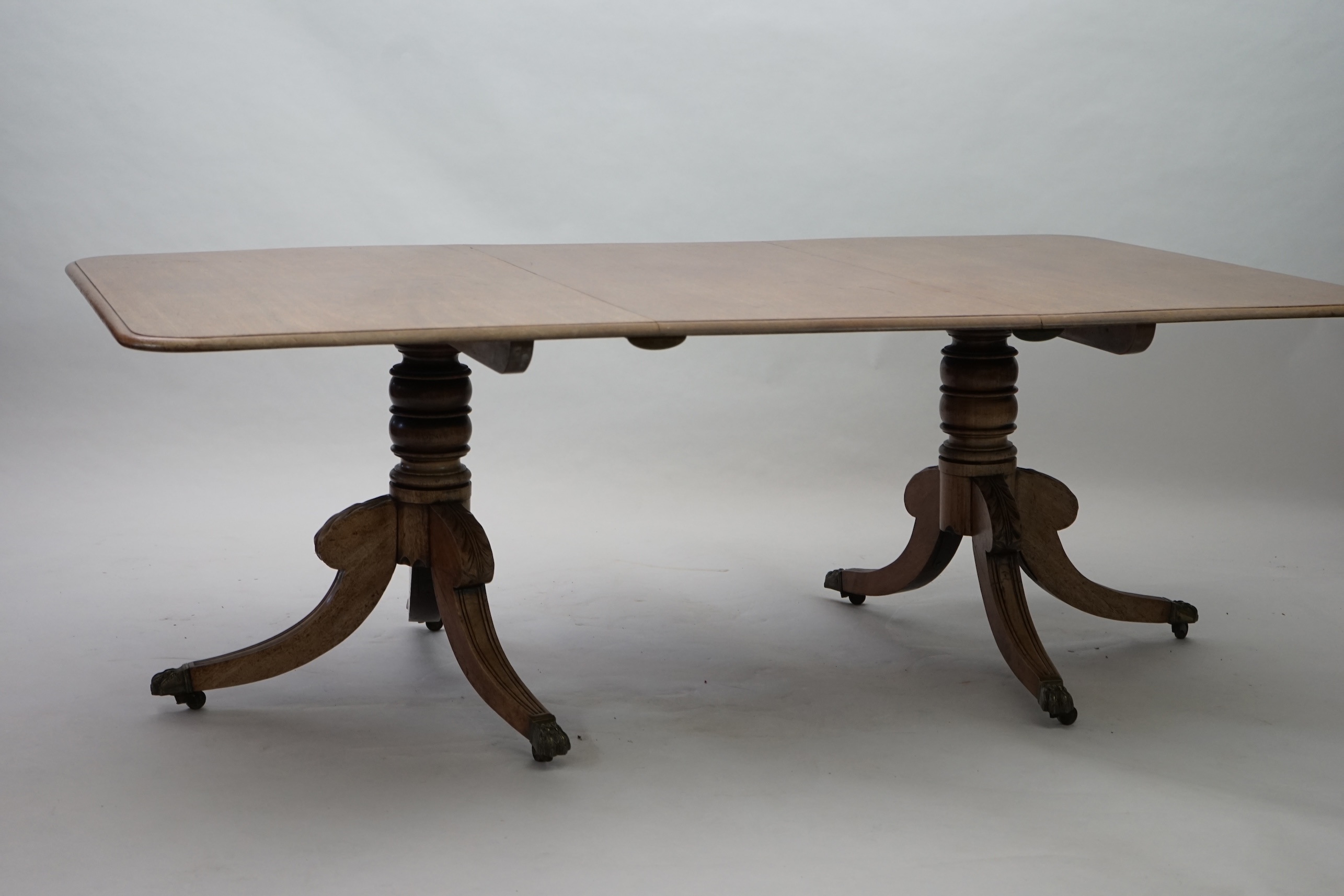 A Regency mahogany extending dining table